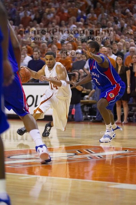 UT junior A.J. Abrams (#3, G) playing defense against a Kansas player. The University of Texas (UT) Longhorns defeated the University of Kansas Jayhawks 72-69 in Austin, Texas on Monday, February 11, 2008.
Filename: SRM_20080211_2158140.jpg
Aperture: f/2.8
Shutter Speed: 1/640
Body: Canon EOS-1D Mark II
Lens: Canon EF 80-200mm f/2.8 L