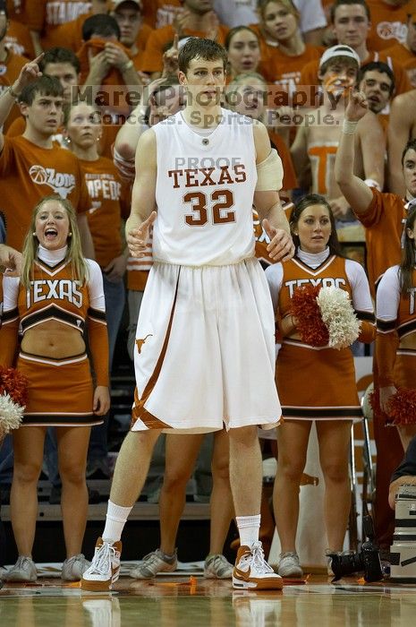 UT junior Connor Atchley (#32, F/C) is significantly taller than the cheerleaders. The University of Texas (UT) Longhorns defeated the University of Kansas Jayhawks 72-69 in Austin, Texas on Monday, February 11, 2008.
Filename: SRM_20080211_2214026.jpg
Aperture: f/2.8
Shutter Speed: 1/640
Body: Canon EOS 20D
Lens: Canon EF 300mm f/2.8 L IS