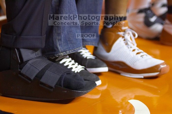 Some player has a broken foot...can't tell who he was (tall white guy).  The University of Texas (UT) Longhorns defeated the University of Kansas Jayhawks 72-69 in Austin, Texas on Monday, February 11, 2008.

Filename: SRM_20080211_2214221.jpg
Aperture: f/2.8
Shutter Speed: 1/250
Body: Canon EOS-1D Mark II
Lens: Canon EF 80-200mm f/2.8 L