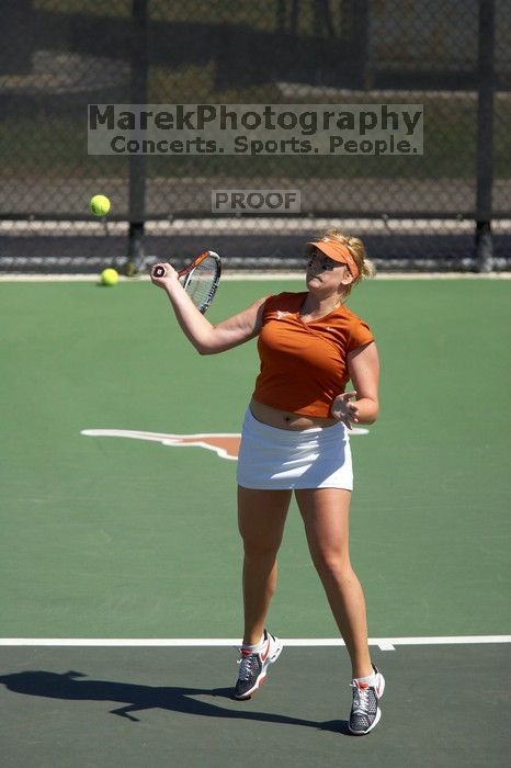 First doubles UT sophomore Vanja Corovic and UT junior Marija Milic defeated CSUS sophomore Aileen Tsan and CSUS junior Anastassia Lyssenko 8-3.  The University of Texas defeated Sacramento State on Saturday, March 22, 2008.

Filename: SRM_20080322_1114325.jpg
Aperture: f/4.0
Shutter Speed: 1/4000
Body: Canon EOS-1D Mark II
Lens: Canon EF 300mm f/2.8 L IS