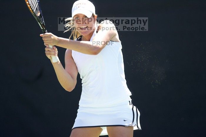 Second singles UT senior Courtney Zauft defeated CSUS junior Anastassia Lyssenko 4-6, 6-3, 10-6.  The University of Texas defeated Sacramento State on Saturday, March 22, 2008.

Filename: SRM_20080322_1306262.jpg
Aperture: f/2.8
Shutter Speed: 1/2000
Body: Canon EOS-1D Mark II
Lens: Canon EF 300mm f/2.8 L IS
