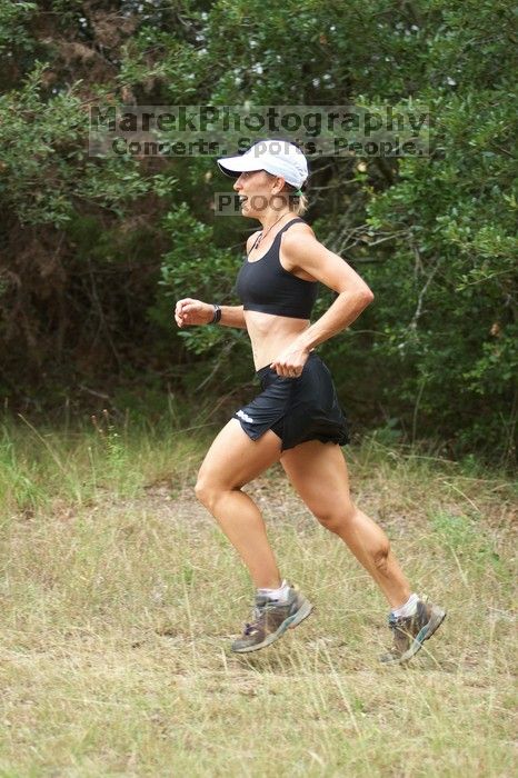 Meredith Terranova running The Saint trail race, sponsored by Rogue, at the Saint Stephen's Episcopal School on Sunday morning, June 29, 2008.

Filename: SRM_20080629_0820108.jpg
Aperture: f/2.8
Shutter Speed: 1/500
Body: Canon EOS 20D
Lens: Canon EF 80-200mm f/2.8 L