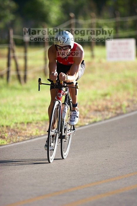 Derek Yorek (bib #128) of Austin placed 1 in his age group (M 25-29) with an overall time of 01:13:10 at The Howdy Du duathlon in Berry Springs Park, Georgetown, Sunday July 6, 2008.

Filename: SRM_20080706_0758163.jpg
Aperture: f/2.8
Shutter Speed: 1/1000
Body: Canon EOS 20D
Lens: Canon EF 300mm f/2.8 L IS