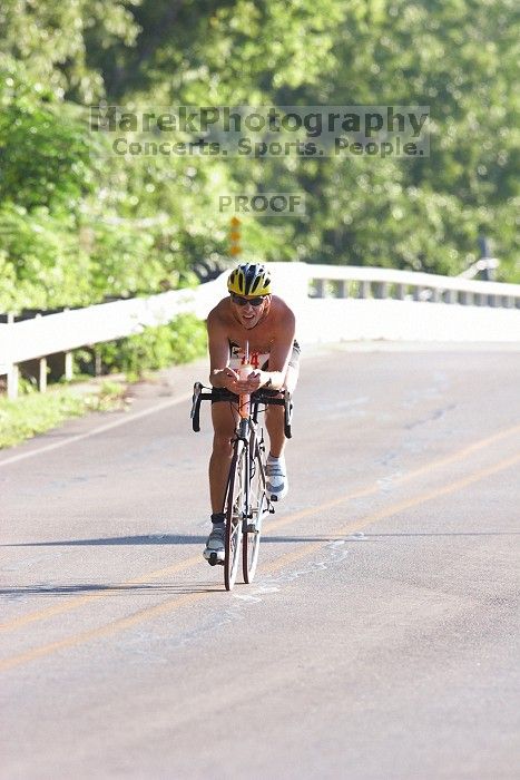James Ornelas (bib #84) of Austin placed 2 in his age group (M 25-29) with an overall time of 01:27:33 at The Howdy Du duathlon in Berry Springs Park, Georgetown, Sunday July 6, 2008.

Filename: SRM_20080706_0804000.jpg
Aperture: f/5.0
Shutter Speed: 1/500
Body: Canon EOS 20D
Lens: Canon EF 300mm f/2.8 L IS