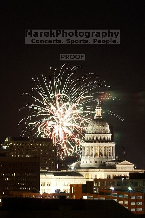Austin Independence Day fireworks with the Capitol building, as viewed from atop the Manor Garage at The University of Texas at Austin.  The fireworks were launched from Auditorium Shores, downtown Austin, Friday, July 4, 2008.

Filename: SRM_20080704_2139105.jpg
Aperture: f/11.0
Shutter Speed: 6/1
Body: Canon EOS 20D
Lens: Canon EF 80-200mm f/2.8 L