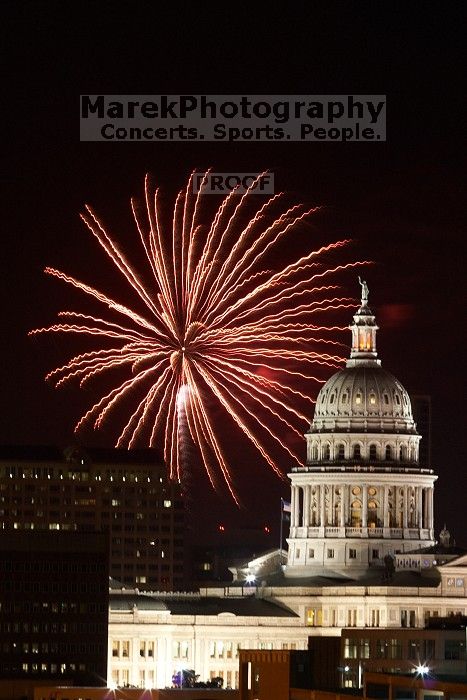 Austin Independence Day fireworks with the Capitol building, as viewed from atop the Manor Garage at The University of Texas at Austin.  The fireworks were launched from Auditorium Shores, downtown Austin, Friday, July 4, 2008.

Filename: SRM_20080704_2150444.jpg
Aperture: f/11.0
Shutter Speed: 5/1
Body: Canon EOS 20D
Lens: Canon EF 80-200mm f/2.8 L