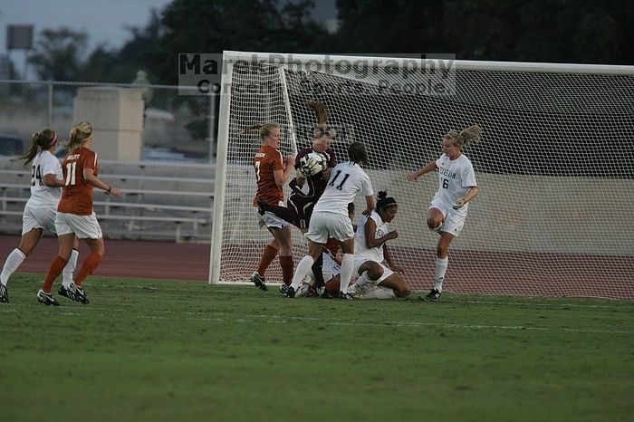 UT freshman Courtney Goodson (#7, Forward and Midfielder) loses the ball to the A&M goalkeeper. The University of Texas women's soccer team tied 0-0 against the Texas A&M Aggies Friday night, September 27, 2008.
Filename: SRM_20080926_1910008.jpg
Aperture: f/4.0
Shutter Speed: 1/1000
Body: Canon EOS-1D Mark II
Lens: Canon EF 300mm f/2.8 L IS