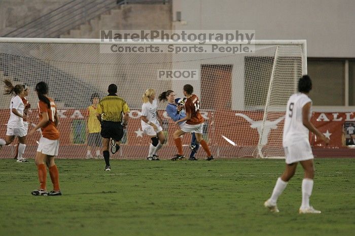 UT freshman Amanda Lisberger (#13, Midfielder) and UT senior Kasey Moore (#14, Defender) watch as UT senior Dianna Pfenninger (#8, Goalkeeper) catches a shot on goal. The University of Texas women's soccer team tied 0-0 against the Texas A&M Aggies Friday night, September 27, 2008.
Filename: SRM_20080926_1928583.jpg
Aperture: f/4.0
Shutter Speed: 1/500
Body: Canon EOS-1D Mark II
Lens: Canon EF 300mm f/2.8 L IS