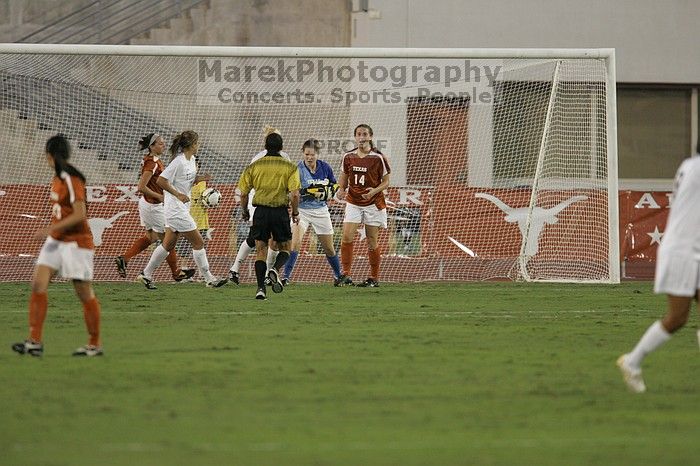 UT freshman Amanda Lisberger (#13, Midfielder) and UT senior Kasey Moore (#14, Defender) watch as UT senior Dianna Pfenninger (#8, Goalkeeper) catches a shot on goal. The University of Texas women's soccer team tied 0-0 against the Texas A&M Aggies Friday night, September 27, 2008.
Filename: SRM_20080926_1929006.jpg
Aperture: f/4.0
Shutter Speed: 1/400
Body: Canon EOS-1D Mark II
Lens: Canon EF 300mm f/2.8 L IS