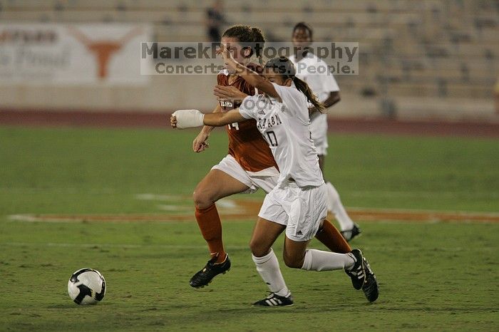 UT senior Kasey Moore (#14, Defender) brings the ball downfield. The University of Texas women's soccer team tied 0-0 against the Texas A&M Aggies Friday night, September 27, 2008.
Filename: SRM_20080926_1935424.jpg
Aperture: f/4.0
Shutter Speed: 1/500
Body: Canon EOS-1D Mark II
Lens: Canon EF 300mm f/2.8 L IS