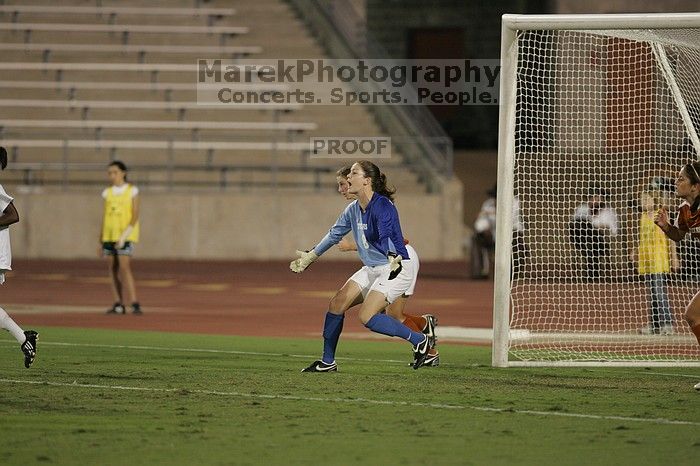 UT senior Dianna Pfenninger (#8, Goalkeeper) tells the defense to push forward. The University of Texas women's soccer team tied 0-0 against the Texas A&M Aggies Friday night, September 27, 2008.
Filename: SRM_20080926_2011503.jpg
Aperture: f/2.8
Shutter Speed: 1/500
Body: Canon EOS-1D Mark II
Lens: Canon EF 300mm f/2.8 L IS