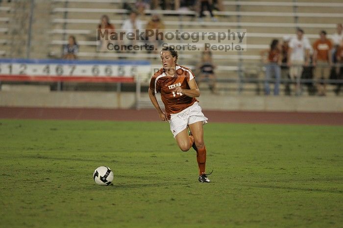 UT senior Kasey Moore (#14, Defender). The University of Texas women's soccer team tied 0-0 against the Texas A&M Aggies Friday night, September 27, 2008.
Filename: SRM_20080926_2012088.jpg
Aperture: f/2.8
Shutter Speed: 1/500
Body: Canon EOS-1D Mark II
Lens: Canon EF 300mm f/2.8 L IS