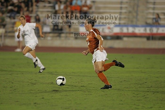 UT senior Kasey Moore (#14, Defender). The University of Texas women's soccer team tied 0-0 against the Texas A&M Aggies Friday night, September 27, 2008.
Filename: SRM_20080926_2012104.jpg
Aperture: f/2.8
Shutter Speed: 1/500
Body: Canon EOS-1D Mark II
Lens: Canon EF 300mm f/2.8 L IS