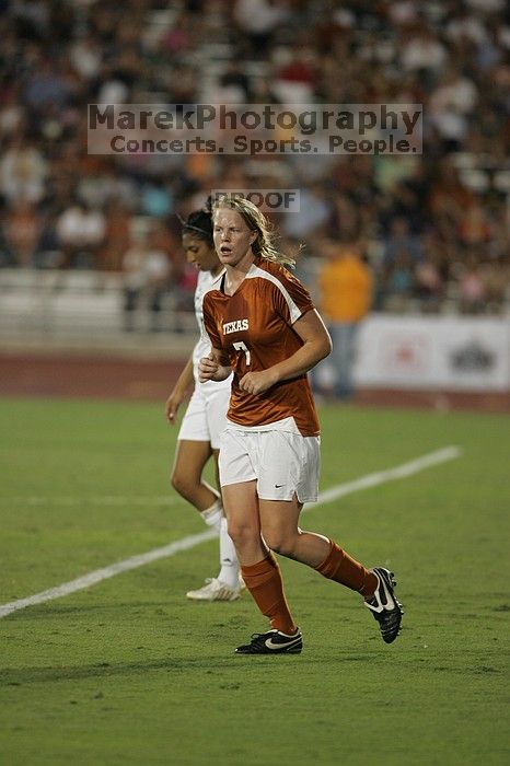 UT freshman Courtney Goodson (#7, Forward and Midfielder) takes the ball down the field. The University of Texas women's soccer team tied 0-0 against the Texas A&M Aggies Friday night, September 27, 2008.
Filename: SRM_20080926_2048404.jpg
Aperture: f/2.8
Shutter Speed: 1/500
Body: Canon EOS-1D Mark II
Lens: Canon EF 300mm f/2.8 L IS