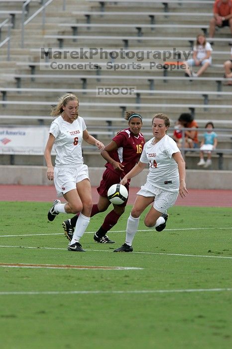 UT freshman Lucy Keith (#6, Midfielder) and UT senior Kasey Moore (#14, Defender) rush to the ball. The University of Texas women's soccer team won 2-1 against the Iowa State Cyclones Sunday afternoon, October 5, 2008.
Filename: SRM_20081005_12022810.jpg
Aperture: f/5.6
Shutter Speed: 1/1250
Body: Canon EOS-1D Mark II
Lens: Canon EF 300mm f/2.8 L IS