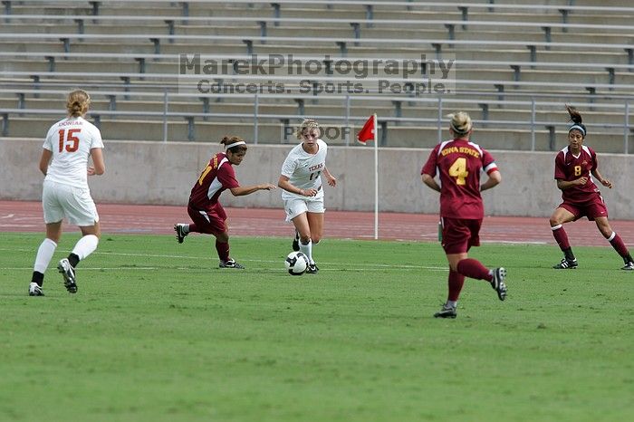 UT sophomore Niki Arlitt (#11, Forward) passes the ball to UT freshman Kylie Doniak (#15, Midfielder).  The University of Texas women's soccer team won 2-1 against the Iowa State Cyclones Sunday afternoon, October 5, 2008.

Filename: SRM_20081005_12095241.jpg
Aperture: f/5.6
Shutter Speed: 1/1600
Body: Canon EOS-1D Mark II
Lens: Canon EF 300mm f/2.8 L IS