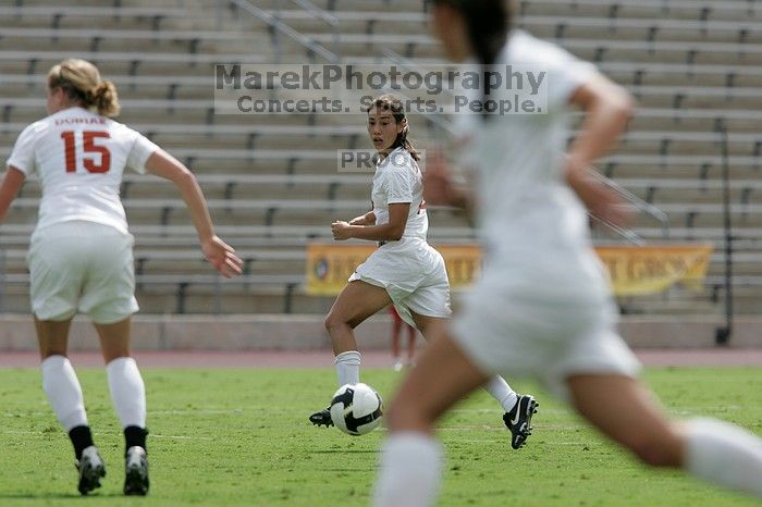 UT senior Stephanie Logterman (#10, Defender) runs with the ball. The University of Texas women's soccer team won 2-1 against the Iowa State Cyclones Sunday afternoon, October 5, 2008.
Filename: SRM_20081005_12314812.jpg
Aperture: f/5.6
Shutter Speed: 1/2500
Body: Canon EOS-1D Mark II
Lens: Canon EF 300mm f/2.8 L IS
