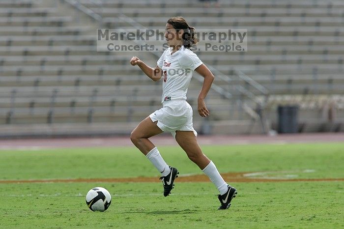 UT senior Stephanie Logterman (#10, Defender) runs with the ball.  The University of Texas women's soccer team won 2-1 against the Iowa State Cyclones Sunday afternoon, October 5, 2008.

Filename: SRM_20081005_12322814.jpg
Aperture: f/5.6
Shutter Speed: 1/2000
Body: Canon EOS-1D Mark II
Lens: Canon EF 300mm f/2.8 L IS