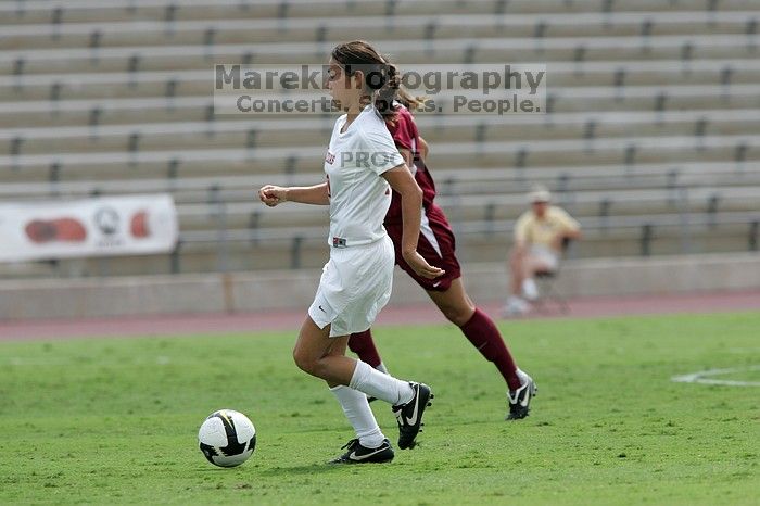 UT senior Stephanie Logterman (#10, Defender) runs with the ball. The University of Texas women's soccer team won 2-1 against the Iowa State Cyclones Sunday afternoon, October 5, 2008.
Filename: SRM_20081005_12322818.jpg
Aperture: f/5.6
Shutter Speed: 1/2000
Body: Canon EOS-1D Mark II
Lens: Canon EF 300mm f/2.8 L IS