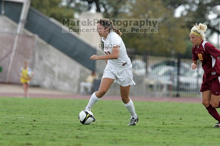 UT junior Stephanie Gibson (#22, Defense and Forward) steals the ball from an Iowa State player. The University of Texas women's soccer team won 2-1 against the Iowa State Cyclones Sunday afternoon, October 5, 2008.
Filename: SRM_20081005_12364448.jpg
Aperture: f/5.6
Shutter Speed: 1/1000
Body: Canon EOS-1D Mark II
Lens: Canon EF 300mm f/2.8 L IS