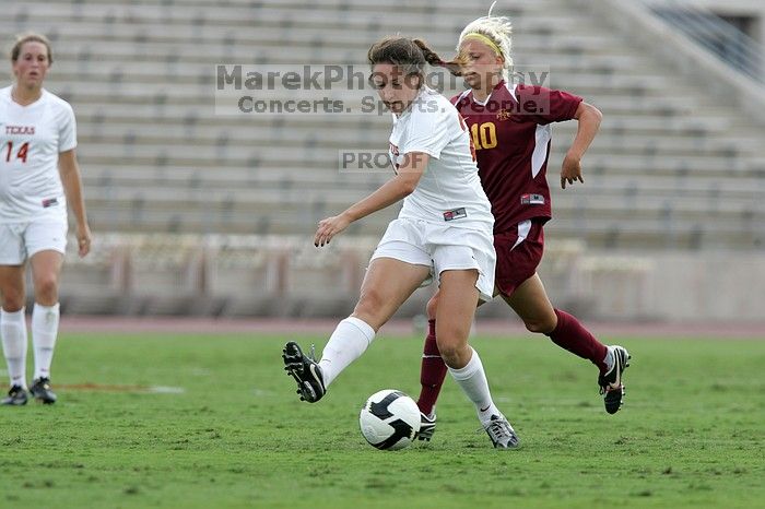 UT junior Stephanie Gibson (#22, Defense and Forward) steals the ball from an Iowa State player. The University of Texas women's soccer team won 2-1 against the Iowa State Cyclones Sunday afternoon, October 5, 2008.
Filename: SRM_20081005_12364857.jpg
Aperture: f/5.6
Shutter Speed: 1/1250
Body: Canon EOS-1D Mark II
Lens: Canon EF 300mm f/2.8 L IS