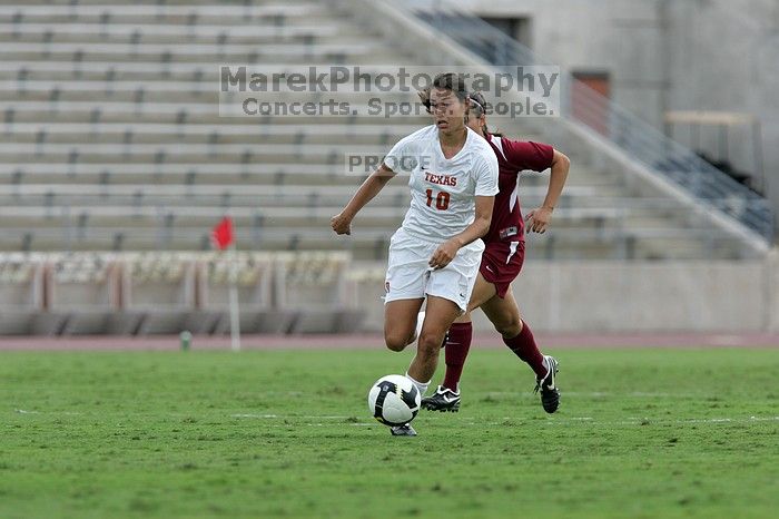 UT senior Stephanie Logterman (#10, Defender) makes a run with the ball. The University of Texas women's soccer team won 2-1 against the Iowa State Cyclones Sunday afternoon, October 5, 2008.
Filename: SRM_20081005_12372460.jpg
Aperture: f/5.6
Shutter Speed: 1/1250
Body: Canon EOS-1D Mark II
Lens: Canon EF 300mm f/2.8 L IS