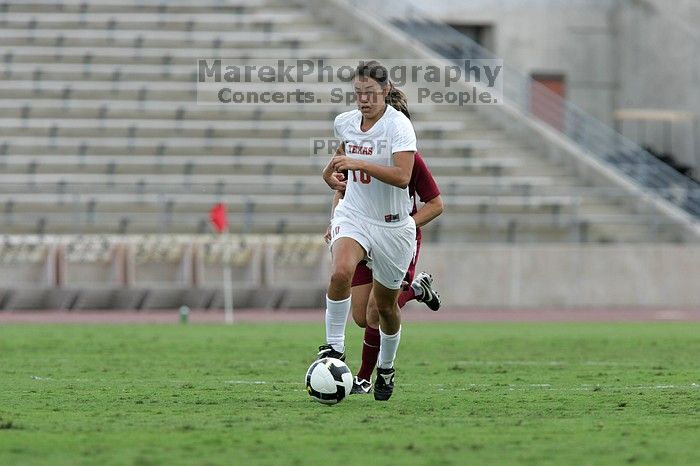 UT senior Stephanie Logterman (#10, Defender) makes a run with the ball.  The University of Texas women's soccer team won 2-1 against the Iowa State Cyclones Sunday afternoon, October 5, 2008.

Filename: SRM_20081005_12372461.jpg
Aperture: f/5.6
Shutter Speed: 1/1250
Body: Canon EOS-1D Mark II
Lens: Canon EF 300mm f/2.8 L IS