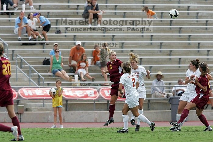 UT sophomore Kirsten Birkhold (#2, Forward and Midfielder) and UT sophomore Kate Nicholson (#17, Forward and Midfielder) fight for the header as UT junior Stephanie Gibson (#22, Defense and Forward) watches. The University of Texas women's soccer team won 2-1 against the Iowa State Cyclones Sunday afternoon, October 5, 2008.
Filename: SRM_20081005_12410099.jpg
Aperture: f/5.6
Shutter Speed: 1/1000
Body: Canon EOS-1D Mark II
Lens: Canon EF 300mm f/2.8 L IS