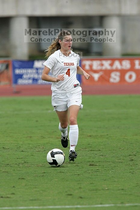 UT senior Jill Gilbeau (#4, Defender and Midfielder) dribbles the ball in the second half. The University of Texas women's soccer team won 2-1 against the Iowa State Cyclones Sunday afternoon, October 5, 2008.
Filename: SRM_20081005_13150005.jpg
Aperture: f/5.6
Shutter Speed: 1/1250
Body: Canon EOS-1D Mark II
Lens: Canon EF 300mm f/2.8 L IS