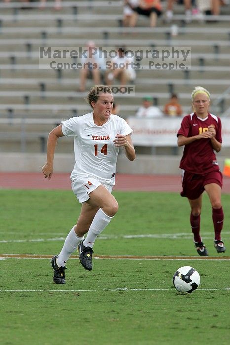 UT senior Kasey Moore (#14, Defender) takes the ball upfield in the second half.  The University of Texas women's soccer team won 2-1 against the Iowa State Cyclones Sunday afternoon, October 5, 2008.

Filename: SRM_20081005_13175264.jpg
Aperture: f/5.6
Shutter Speed: 1/1250
Body: Canon EOS-1D Mark II
Lens: Canon EF 300mm f/2.8 L IS