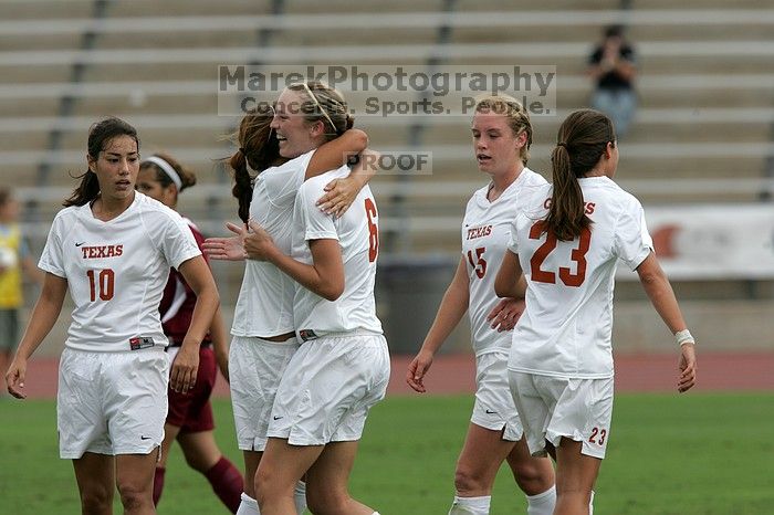 UT sophomore Alisha Ortiz (#12, Forward) congratulates UT freshman Lucy Keith (#6, Midfielder) on her goal in the second half. The University of Texas women's soccer team won 2-1 against the Iowa State Cyclones Sunday afternoon, October 5, 2008.
Filename: SRM_20081005_13190415.jpg
Aperture: f/5.6
Shutter Speed: 1/2000
Body: Canon EOS-1D Mark II
Lens: Canon EF 300mm f/2.8 L IS