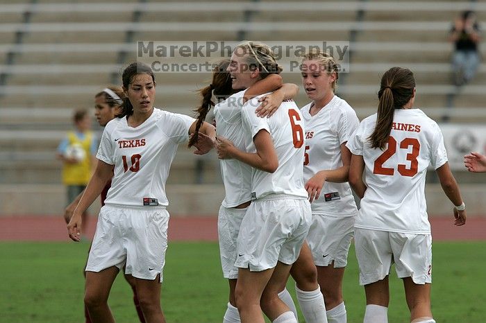 UT sophomore Alisha Ortiz (#12, Forward) congratulates UT freshman Lucy Keith (#6, Midfielder) on her goal in the second half. The University of Texas women's soccer team won 2-1 against the Iowa State Cyclones Sunday afternoon, October 5, 2008.
Filename: SRM_20081005_13190418.jpg
Aperture: f/5.6
Shutter Speed: 1/2000
Body: Canon EOS-1D Mark II
Lens: Canon EF 300mm f/2.8 L IS