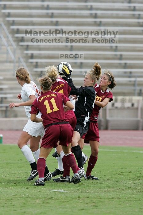 UT freshman Kylie Doniak (#15, Midfielder) and UT sophomore Kate Nicholson (#17, Forward and Midfielder) try for the header but the Iowa State goalkeeper gets to it first in the second half. The University of Texas women's soccer team won 2-1 against the Iowa State Cyclones Sunday afternoon, October 5, 2008.
Filename: SRM_20081005_13403243.jpg
Aperture: f/5.6
Shutter Speed: 1/1250
Body: Canon EOS-1D Mark II
Lens: Canon EF 300mm f/2.8 L IS