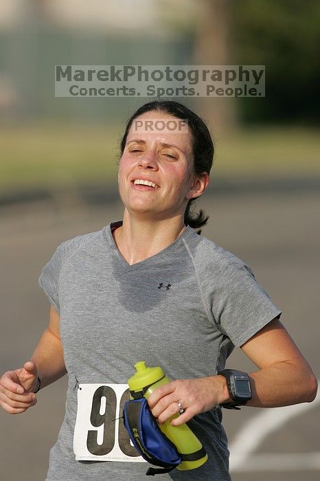 Beth Marek won first place in her age division at the Army Dillo half-marathon and 32K race.
Filename: SRM_20080921_0841444.jpg
Aperture: f/4.0
Shutter Speed: 1/2000
Body: Canon EOS-1D Mark II
Lens: Canon EF 300mm f/2.8 L IS