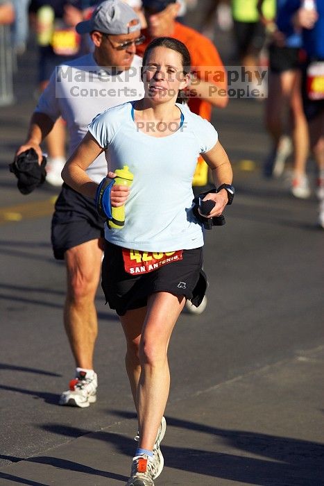 Beth Marek, bib #4236, completed the course in 3:38:21, a Boston Marathon qualifying time.  The first annual San Antonio Rock and Roll Marathon, Sunday, November 16, 2008.

Filename: SRM_20081116_08520619.jpg
Aperture: f/4.0
Shutter Speed: 1/3200
Body: Canon EOS-1D Mark II
Lens: Canon EF 300mm f/2.8 L IS