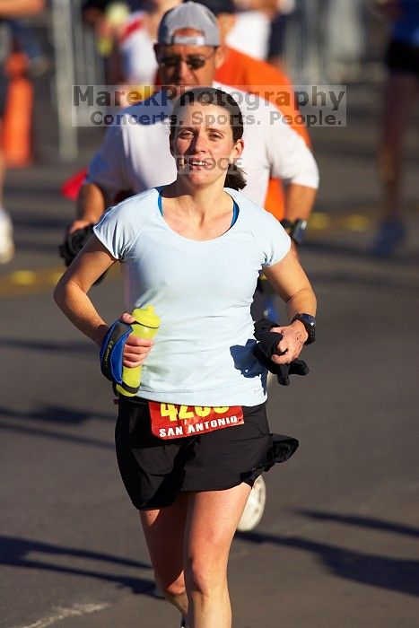 Beth Marek, bib #4236, completed the course in 3:38:21, a Boston Marathon qualifying time.  The first annual San Antonio Rock and Roll Marathon, Sunday, November 16, 2008.

Filename: SRM_20081116_08520823.jpg
Aperture: f/4.0
Shutter Speed: 1/3200
Body: Canon EOS-1D Mark II
Lens: Canon EF 300mm f/2.8 L IS
