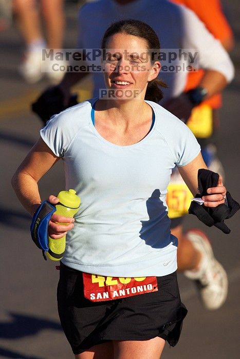 Beth Marek, bib #4236, completed the course in 3:38:21, a Boston Marathon qualifying time.  The first annual San Antonio Rock and Roll Marathon, Sunday, November 16, 2008.

Filename: SRM_20081116_08521025.jpg
Aperture: f/4.0
Shutter Speed: 1/4000
Body: Canon EOS-1D Mark II
Lens: Canon EF 300mm f/2.8 L IS