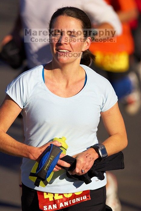 Beth Marek, bib #4236, completed the course in 3:38:21, a Boston Marathon qualifying time.  The first annual San Antonio Rock and Roll Marathon, Sunday, November 16, 2008.

Filename: SRM_20081116_08521428.jpg
Aperture: f/4.0
Shutter Speed: 1/4000
Body: Canon EOS-1D Mark II
Lens: Canon EF 300mm f/2.8 L IS