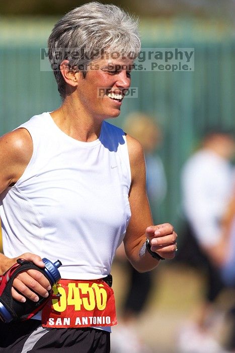 Karen Pearce.  The first annual San Antonio Rock and Roll Marathon, Sunday, November 16, 2008.

Filename: SRM_20081116_12014674.jpg
Aperture: f/4.0
Shutter Speed: 1/3200
Body: Canon EOS-1D Mark II
Lens: Canon EF 300mm f/2.8 L IS