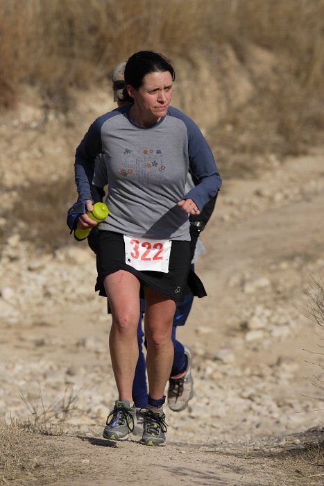 Beth Marek placed 5th in her age group in the 25K at the. Bandera 25K, 50K, and 100K trail race in Bandera, TX on Saturday, January 10, 2009.
Filename: SRM_20090110_10181407.jpg
Aperture: f/5.6
Shutter Speed: 1/800
Body: Canon EOS-1D Mark II
Lens: Canon EF 300mm f/2.8 L IS