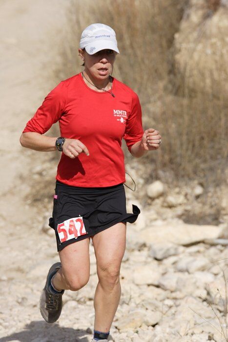 Meredith Terranova placed second overall in the 50K at the Bandera 25K, 50K, and 100K trail race in Bandera, TX on Saturday, January 10, 2009.
Filename: SRM_20090110_12423230.jpg
Aperture: f/5.6
Shutter Speed: 1/800
Body: Canon EOS-1D Mark II
Lens: Canon EF 300mm f/2.8 L IS