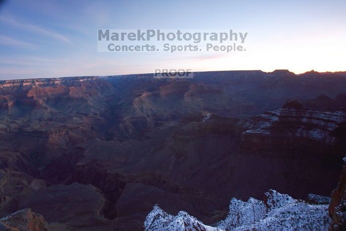 First sunrise of the new year at the south rim of the Grand Canyon, Thursday January 1, 2009.  The temperature was as low as 15 F the night before with a foot and a half of snow on the ground.  Luckily sunrise wasn't until 7:40.

Filename: SRM_20090101_07080687.JPG
Aperture: f/11.0
Shutter Speed: 25/1
Body: Canon EOS-1D Mark II
Lens: Canon EF 16-35mm f/2.8 L