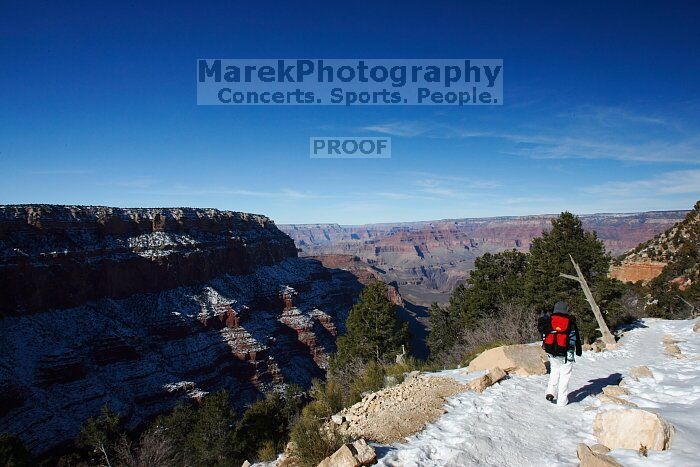Beth Marek hiking down the South Kaibab trail, backpacking the Grand Canyon with Beth, Thursday, January 1, 2009.

Filename: SRM_20090101_12012362.jpg
Aperture: f/16.0
Shutter Speed: 1/200
Body: Canon EOS-1D Mark II
Lens: Canon EF 16-35mm f/2.8 L