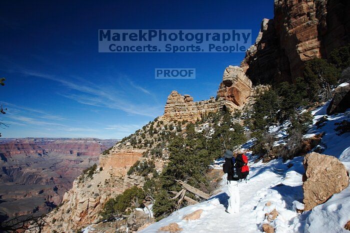 Beth Marek hiking down the South Kaibab trail, backpacking the Grand Canyon with Beth, Thursday, January 1, 2009.

Filename: SRM_20090101_12100573.jpg
Aperture: f/16.0
Shutter Speed: 1/160
Body: Canon EOS-1D Mark II
Lens: Canon EF 16-35mm f/2.8 L