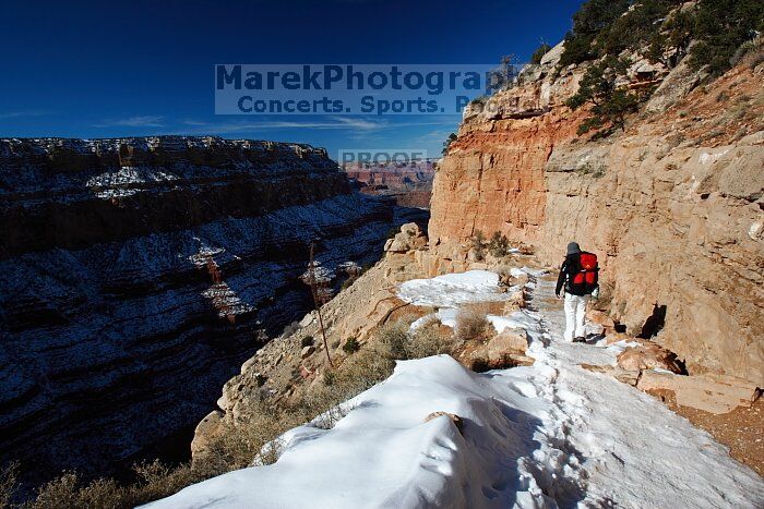 Beth Marek hiking down the South Kaibab trail, backpacking the Grand Canyon with Beth, Thursday, January 1, 2009.
Filename: SRM_20090101_12175585.jpg
Aperture: f/11.0
Shutter Speed: 1/160
Body: Canon EOS-1D Mark II
Lens: Canon EF 16-35mm f/2.8 L