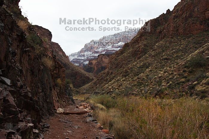 Hiking up the Bright Angel trail from Bright Angel campground to Indian Garden campground, while backpacking the Grand Canyon with Beth, Saturday, January 3, 2009.
Filename: SRM_20090103_11193444.JPG
Aperture: f/11.0
Shutter Speed: 1/30
Body: Canon EOS-1D Mark II
Lens: Canon EF 16-35mm f/2.8 L