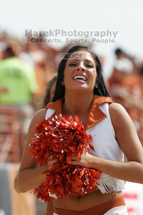 Texas Pom. The University of Texas football team defeated the Arkansas Razorbacks with a score of 52-10 in Austin, TX on Saturday, September 27, 2008.
Filename: SRM_20080927_15414885.jpg
Aperture: f/5.6
Shutter Speed: 1/1250
Body: Canon EOS-1D Mark II
Lens: Canon EF 300mm f/2.8 L IS