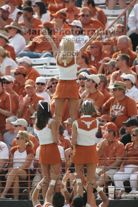 Texas Cheerleaders. The University of Texas football team defeated the Arkansas Razorbacks with a score of 52-10 in Austin, TX on Saturday, September 27, 2008.
Filename: SRM_20080927_15480683.jpg
Aperture: f/5.6
Shutter Speed: 1/1000
Body: Canon EOS-1D Mark II
Lens: Canon EF 300mm f/2.8 L IS