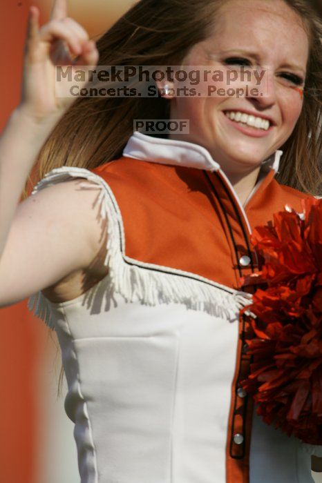 Texas Cheerleaders.  The University of Texas football team defeated the Arkansas Razorbacks with a score of 52-10 in Austin, TX on Saturday, September 27, 2008.

Filename: SRM_20080927_17025289.jpg
Aperture: f/5.6
Shutter Speed: 1/2500
Body: Canon EOS-1D Mark II
Lens: Canon EF 300mm f/2.8 L IS