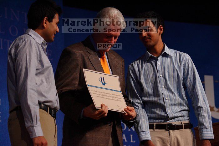 Former President Bill Clinton hands out commitment certificates to CGIU attendees for their exceptional pledges to the CGI cause during the opening plenary session of the CGIU meeting. Day one of the 2nd Annual Clinton Global Initiative University (CGIU) meeting was held at The University of Texas at Austin, Friday, February 13, 2009.
Filename: SRM_20090213_16425384.jpg
Aperture: f/4.0
Shutter Speed: 1/320
Body: Canon EOS-1D Mark II
Lens: Canon EF 80-200mm f/2.8 L